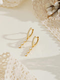 Exquisite diamond hoop earrings featuring tassels and crystal pendants; crafted from 18K gold and 925 sterling silver