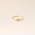 14K gold-plated knot ring—a delicate, minimalist piece perfect for stacking; band width: 1mm
