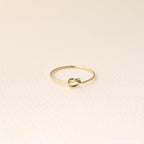 14K gold-plated knot ring—a delicate, minimalist piece perfect for stacking; band width: 1mm