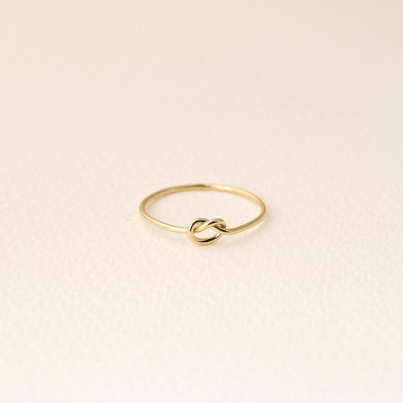 14K gold-plated knot ring—a delicate, minimalist piece perfect for stacking; band width: 1mm
