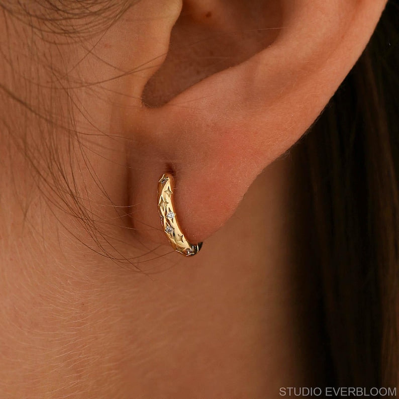 Star-motif cubic zirconia (CZ) huggie earrings, crafted from 925 sterling silver, 10 mm in diameter