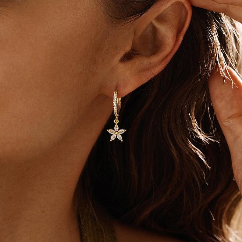 Gold flower-motif hoop earrings, delicate clip-style drop earrings