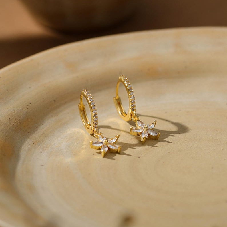 Gold flower-motif hoop earrings, delicate clip-style drop earrings