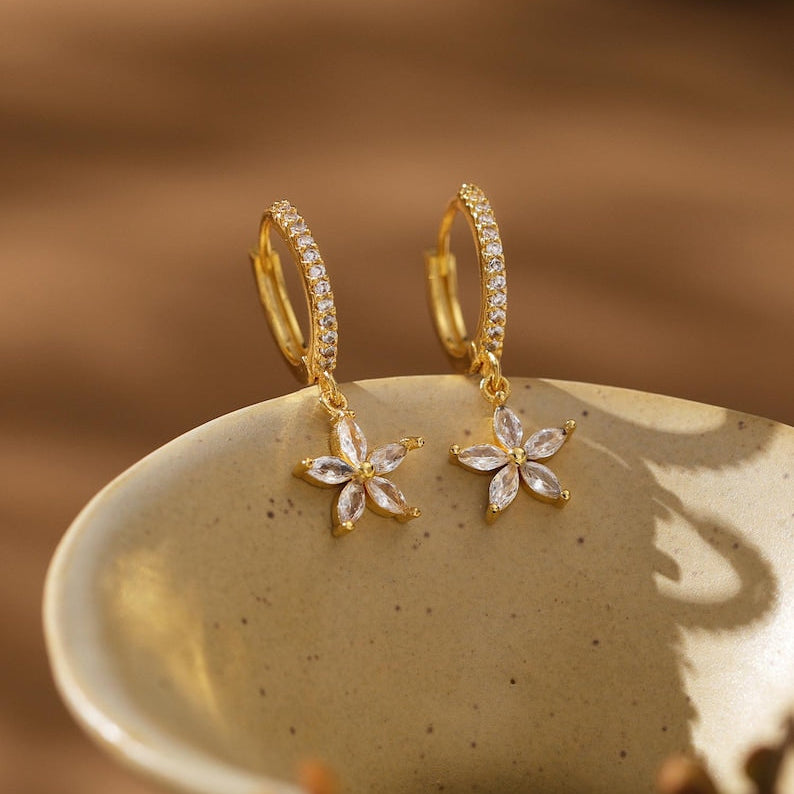 Gold flower-motif hoop earrings, delicate clip-style drop earrings