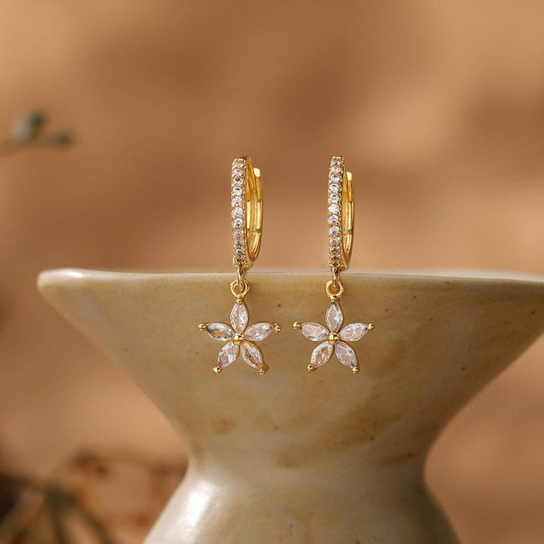 Gold flower-motif hoop earrings, delicate clip-style drop earrings