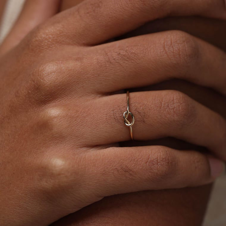 14K gold-plated knot ring—a delicate, minimalist piece perfect for stacking; band width: 1mm