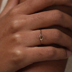 14K gold-plated knot ring—a delicate, minimalist piece perfect for stacking; band width: 1mm