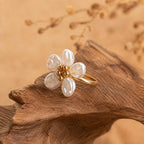 Gold-tone adjustable open ring, adorned with five faux Baroque pearl petals