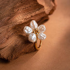 Gold-tone adjustable open ring, adorned with five faux Baroque pearl petals