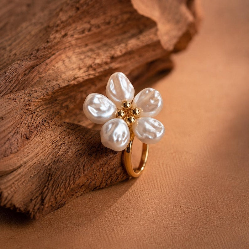 Gold-tone adjustable open ring, adorned with five faux Baroque pearl petals