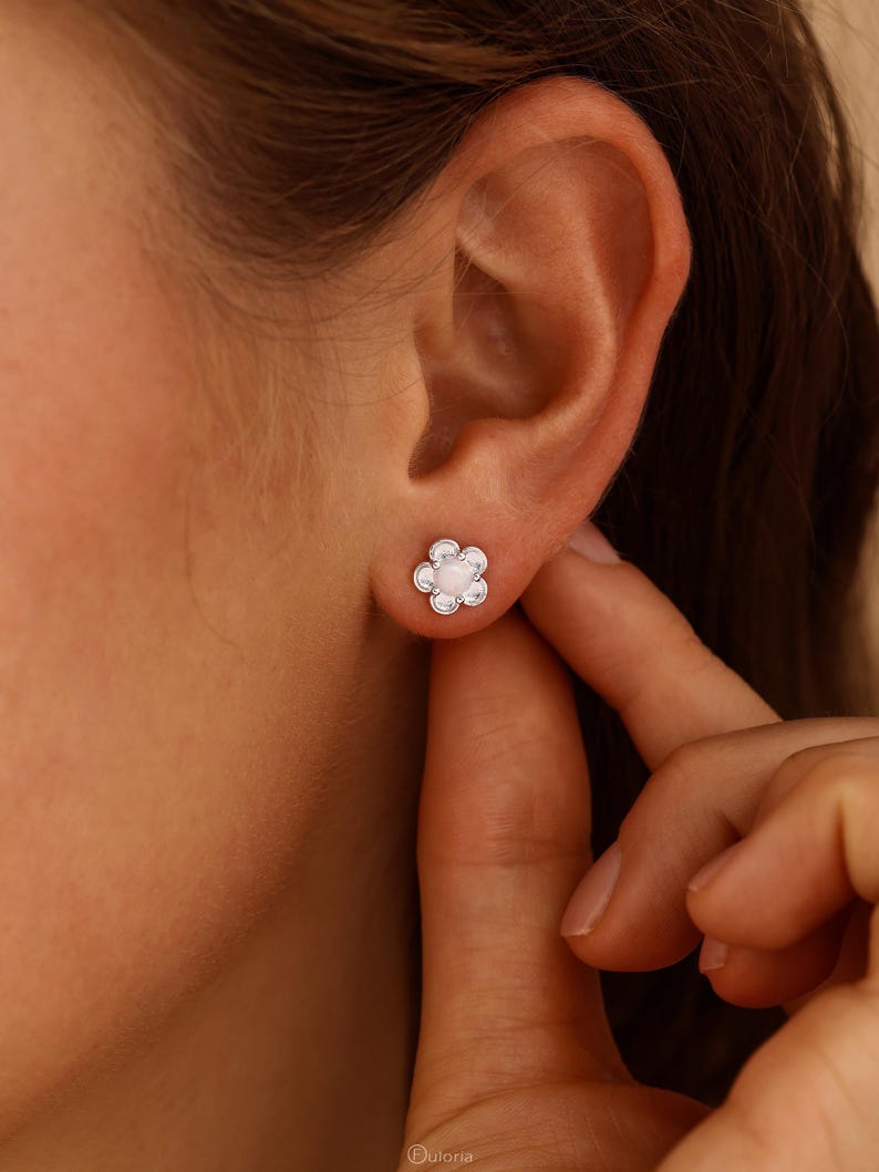 Floral opal stud earrings, available in 18K gold or 925 sterling silver, featuring white opals in a minimalist floral design
