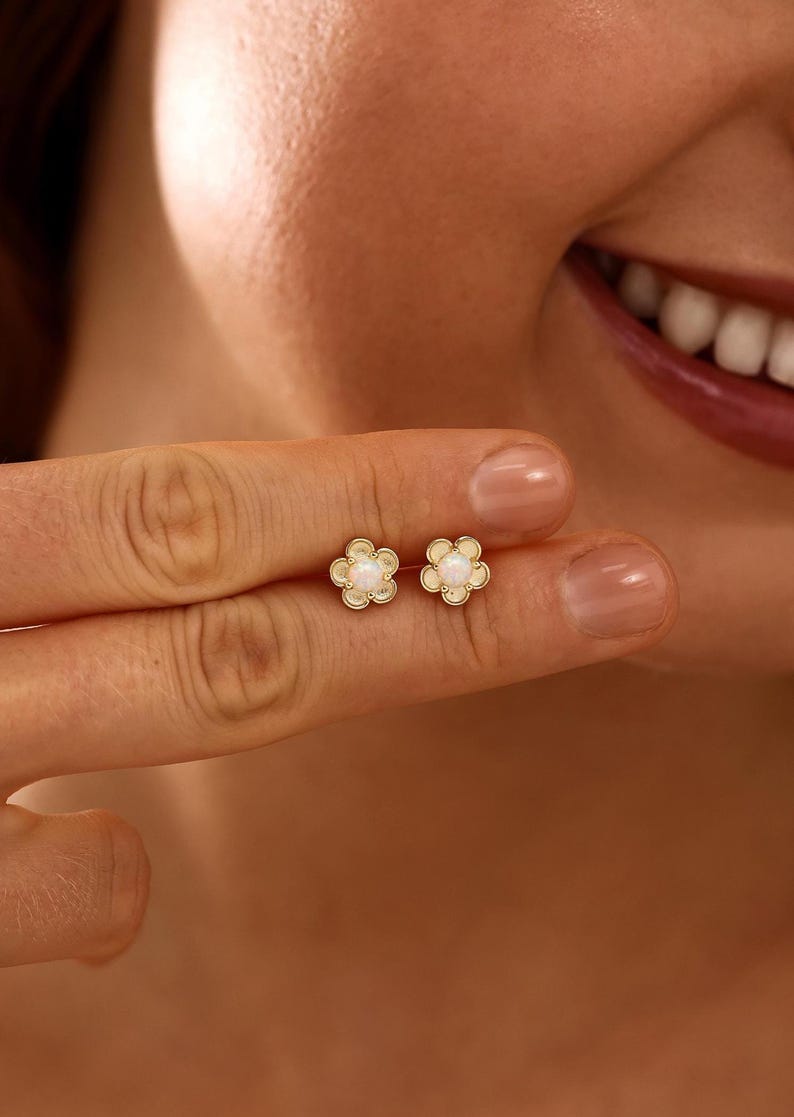 Floral opal stud earrings, available in 18K gold or 925 sterling silver, featuring white opals in a minimalist floral design