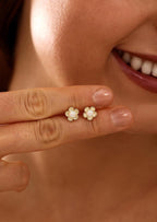 Floral opal stud earrings, available in 18K gold or 925 sterling silver, featuring white opals in a minimalist floral design
