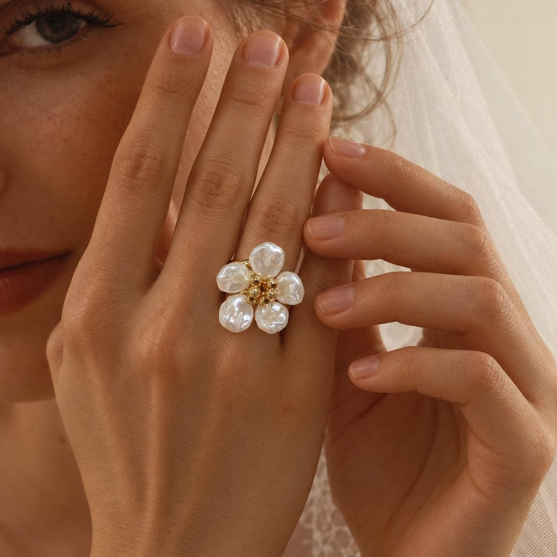 Gold-tone adjustable open ring, adorned with five faux Baroque pearl petals