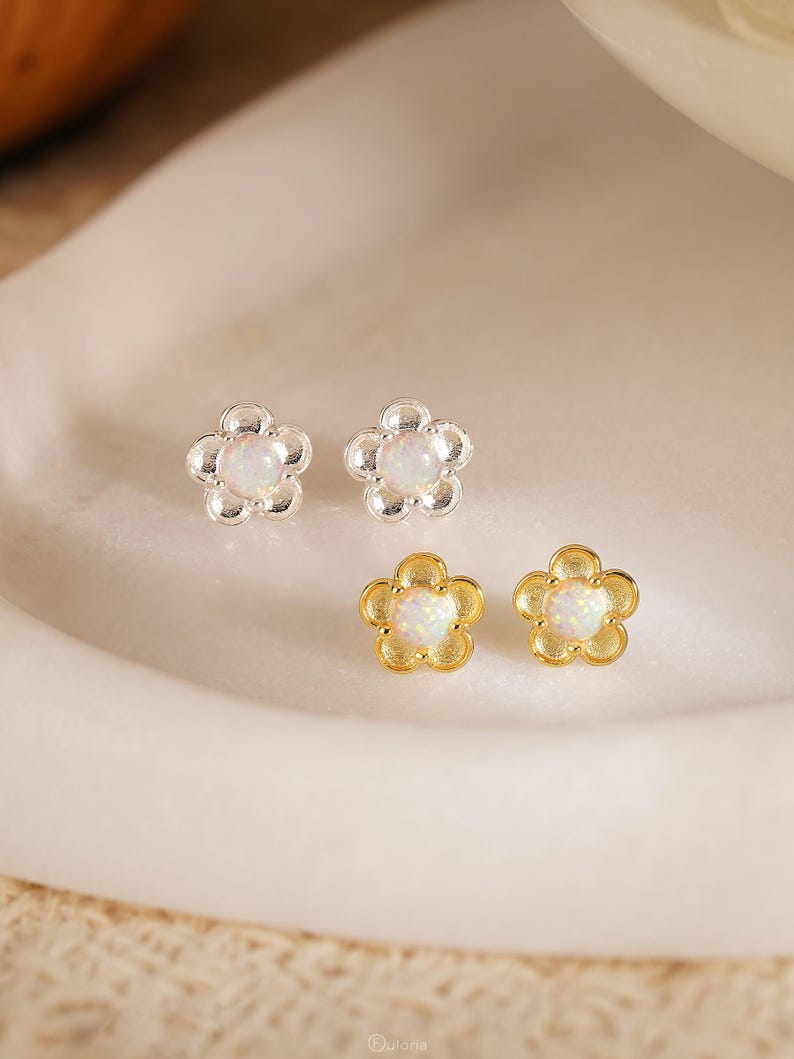 Floral opal stud earrings, available in 18K gold or 925 sterling silver, featuring white opals in a minimalist floral design