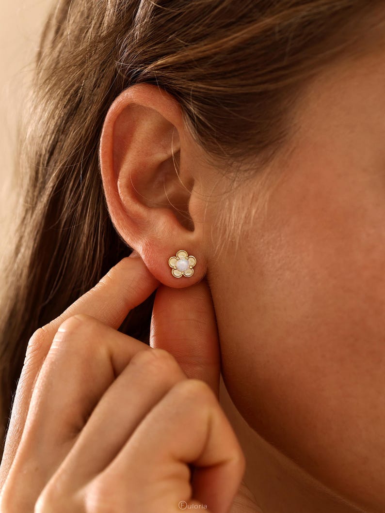Floral opal stud earrings, available in 18K gold or 925 sterling silver, featuring white opals in a minimalist floral design